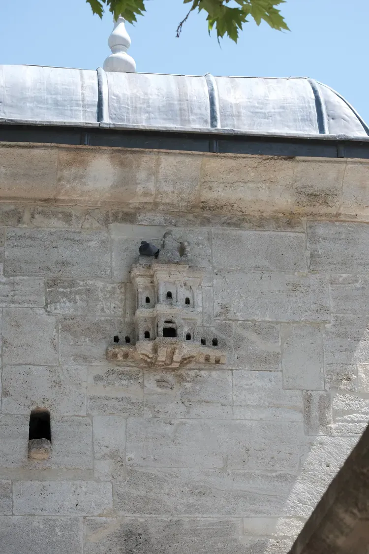 An Ottoman carved birdhouse, a kus evi, on a stone wall in Istanbul