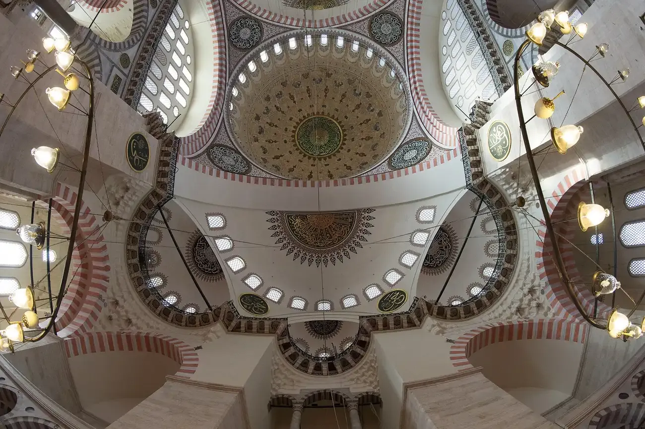 Half domes and chandeliers inside the Suleymaniye Mosque in Istanbul