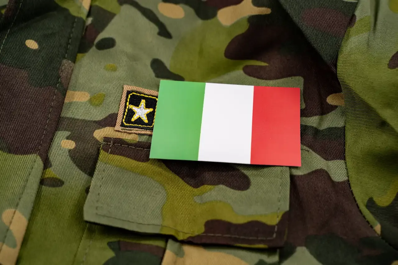 Close-up of the Italian flag on a military camouflage uniform