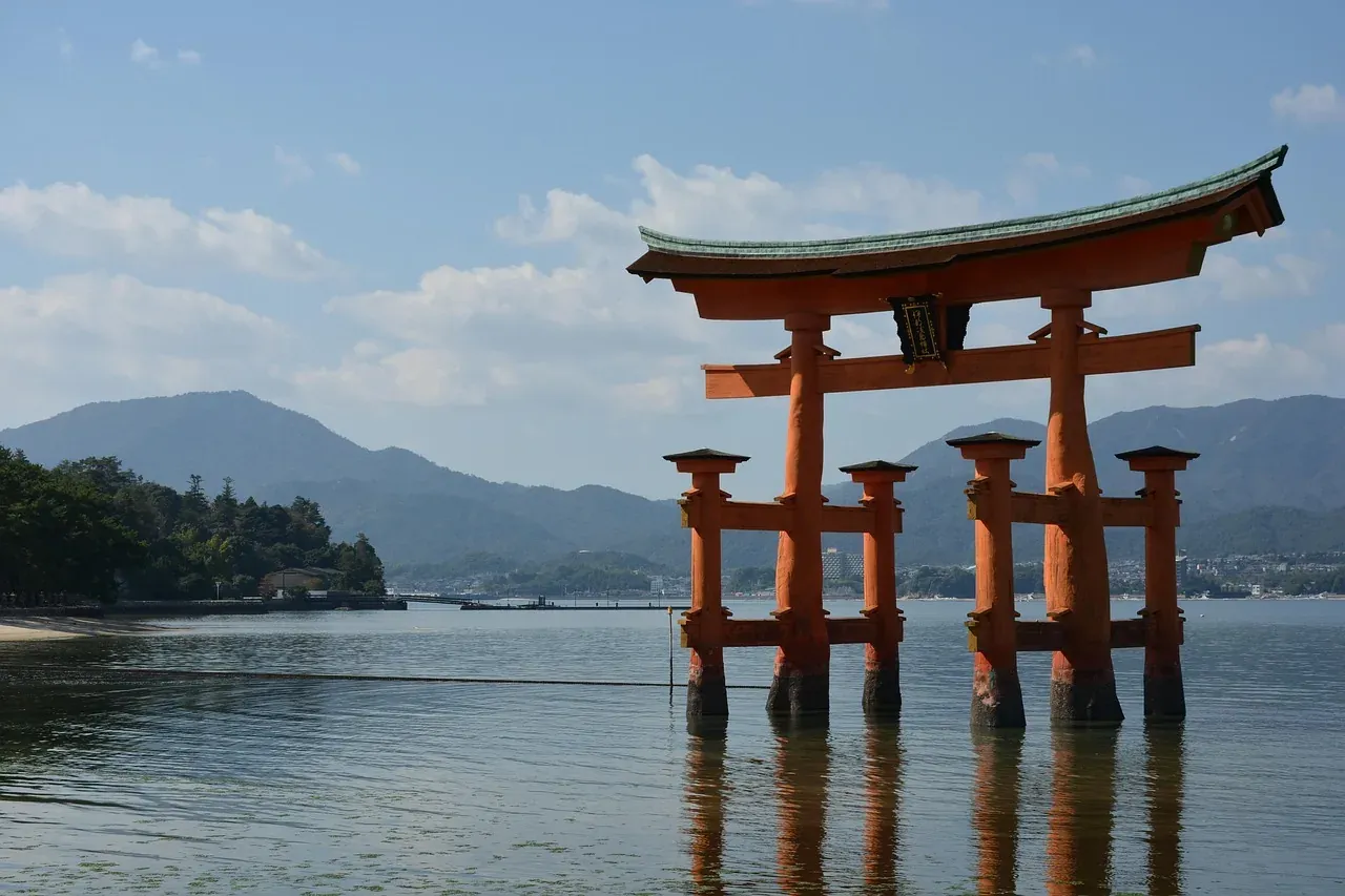 The floating torii of Itsukushima Shrine standing in the bay at Miyajima