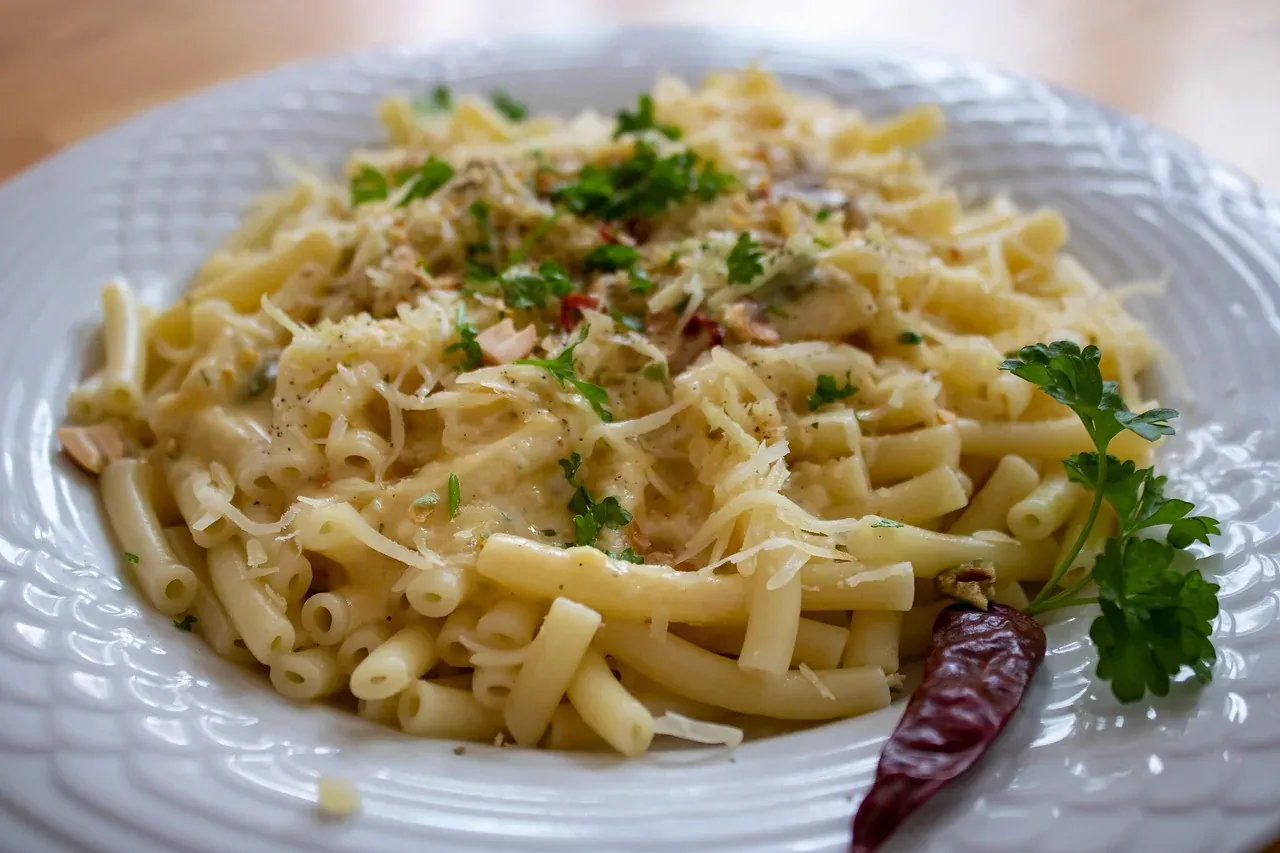 Käsespätzle, soft egg noodles with melted cheese and herbs