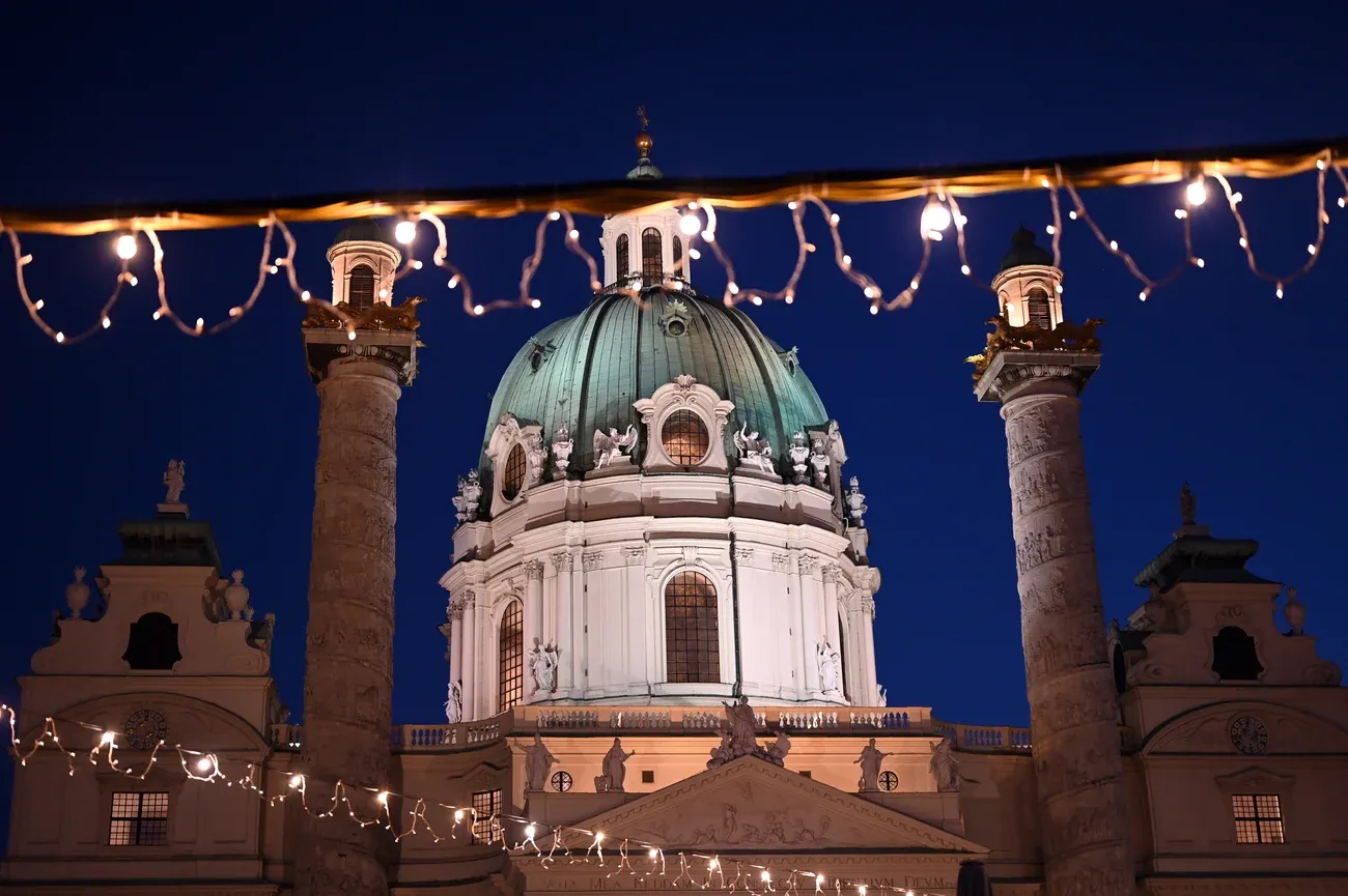 Karlskirche on Karlsplatz framed by Christmas lights at night, Vienna