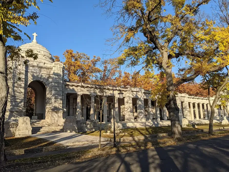 The arcaded gallery of tombs and a domed mausoleum pavilion at Kerepesi Cemetery in Budapest in autumn