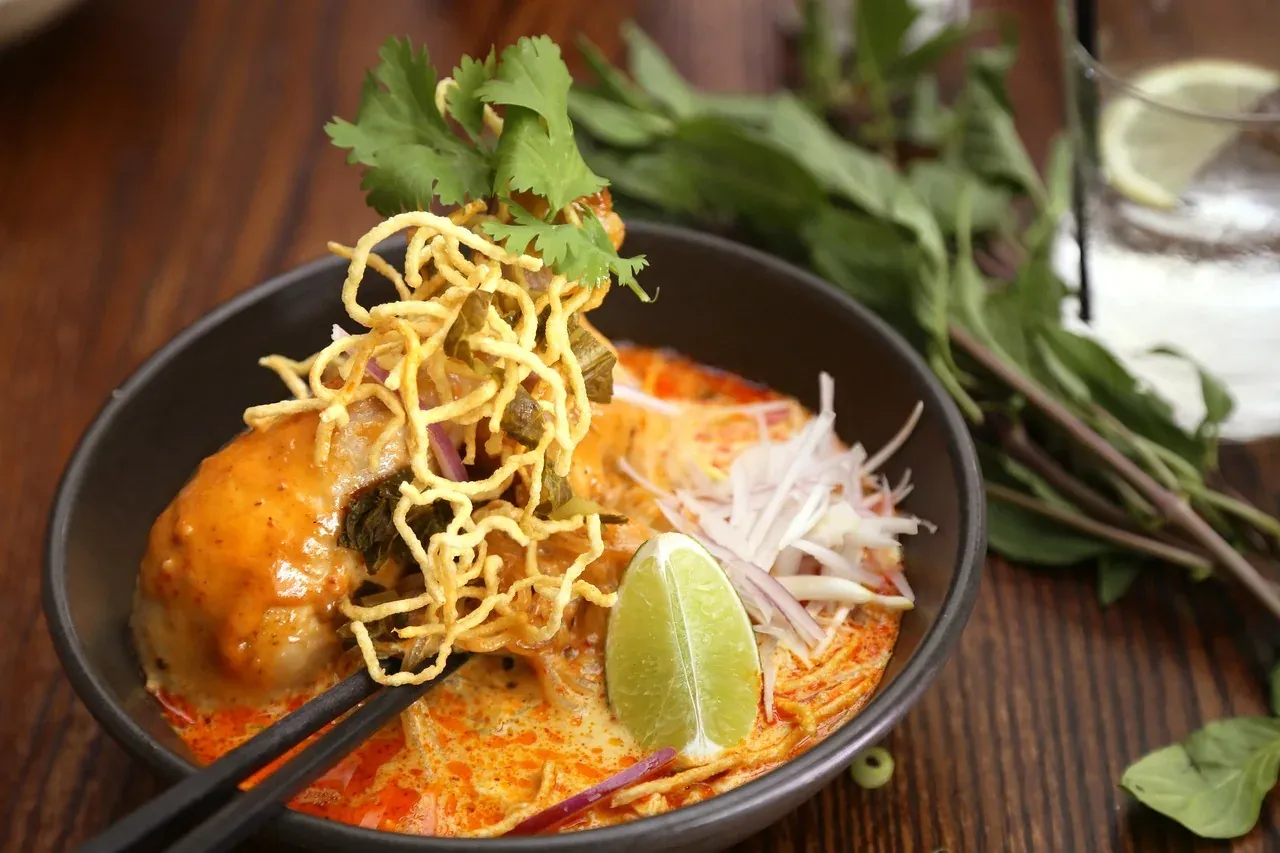 Khao soi, the northern Thai curry noodle soup, in a bowl