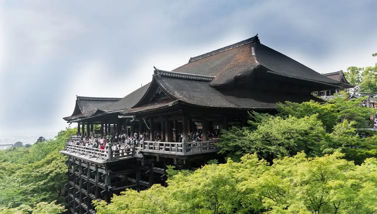 The wooden veranda of Kiyomizu-dera on its tall pillars above the Higashiyama slope in Kyoto