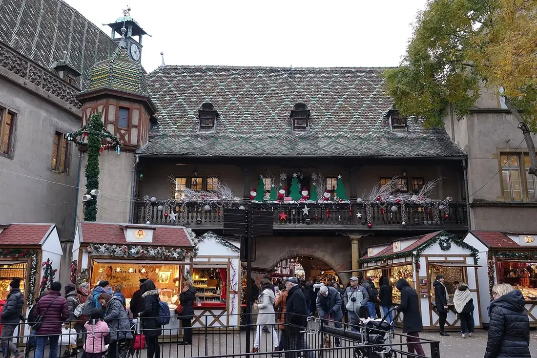 The Koïfhus, Colmar's old customs house, with Christmas market chalets in front of it