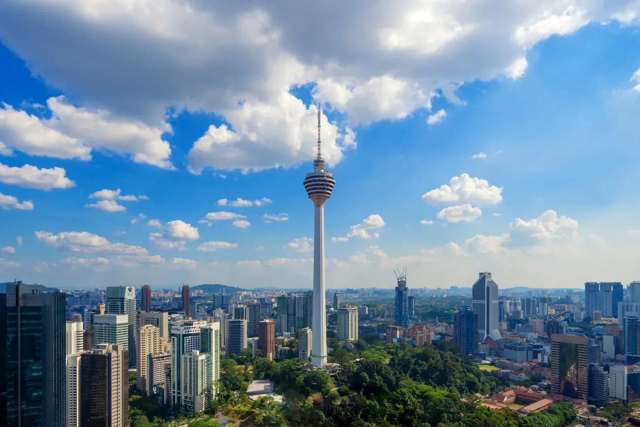 An aerial view of the Menara Kuala Lumpur tower and downtown Kuala Lumpur