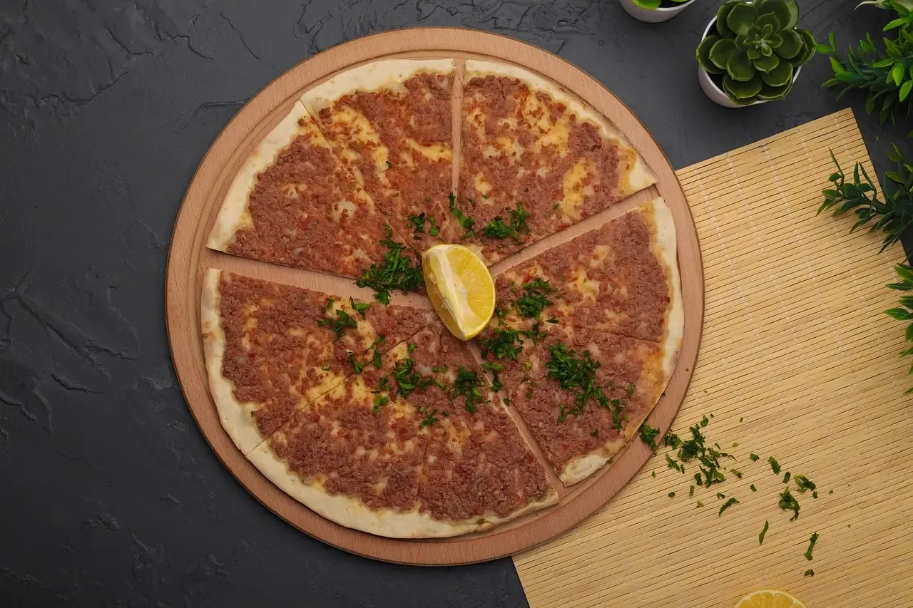 Lahmacun flatbread served with lemon and parsley