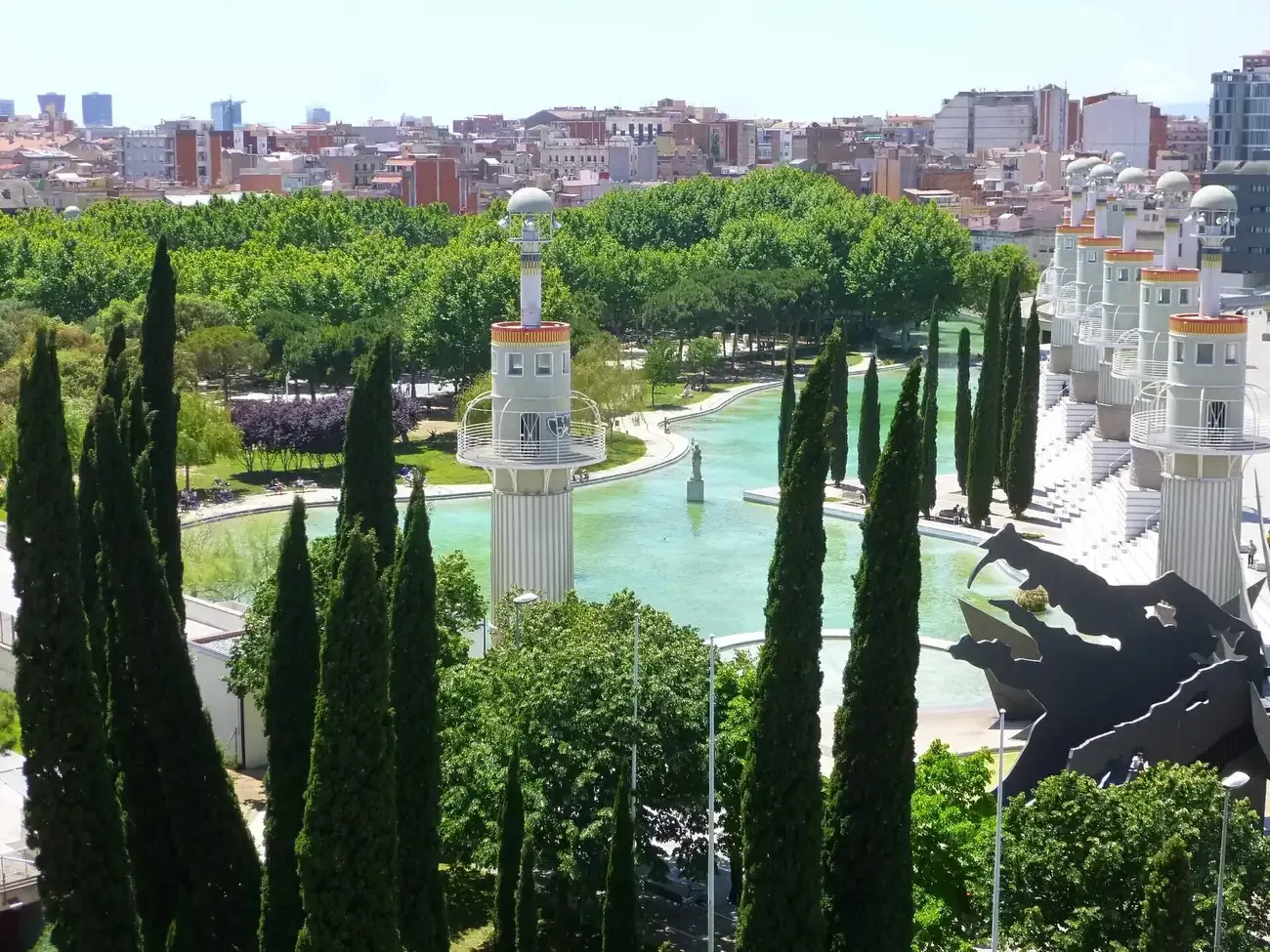 Lake and lighthouse towers of Parc de l'Espanya Industrial in Barcelona