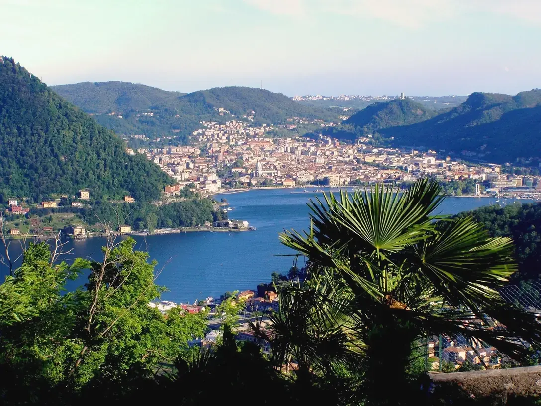 The first basin of Lake Como and the city of Como seen from the wooded hills above the lake