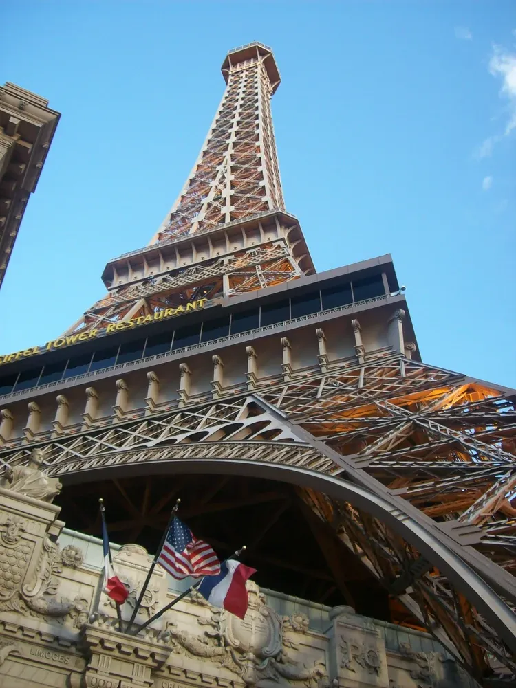 Eiffel Tower replica rising above the Eiffel Tower Restaurant sign at the Paris hotel on the Las Vegas Strip