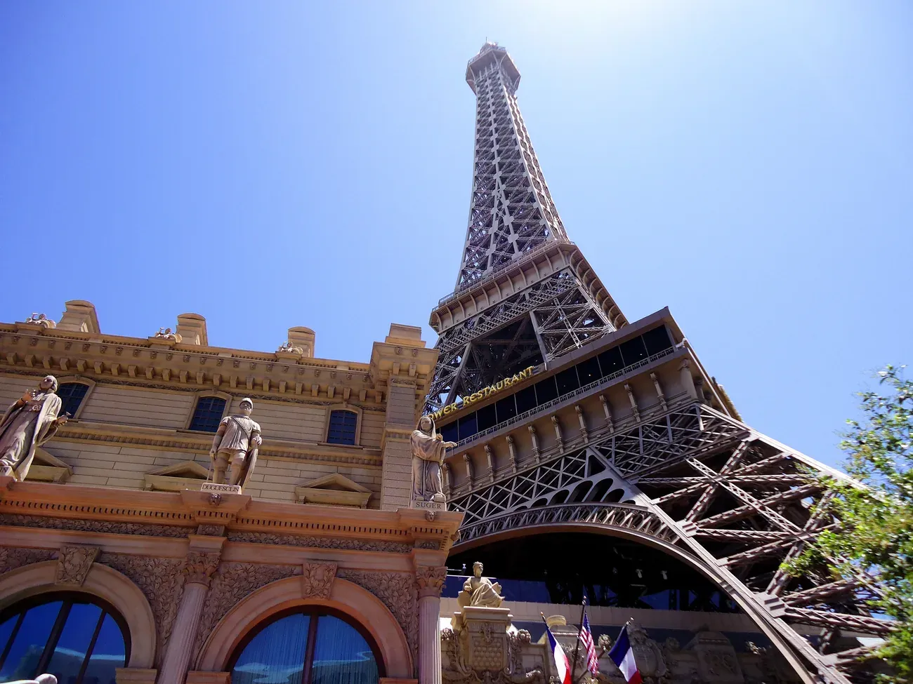 Statues along the facade of the Paris hotel with its Eiffel Tower replica overhead on the Las Vegas Strip