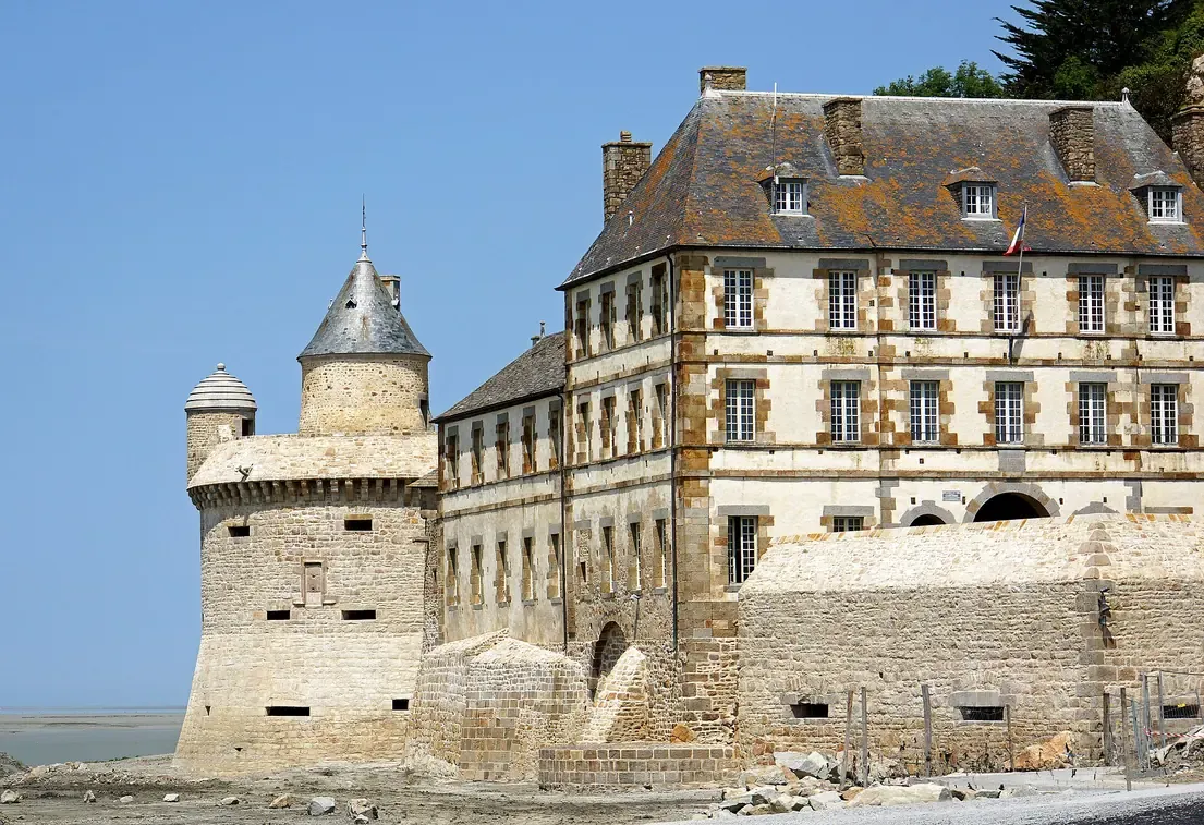 The round Tour Gabriel with its conical roof and machicolated parapet on the western ramparts of Mont-Saint-Michel