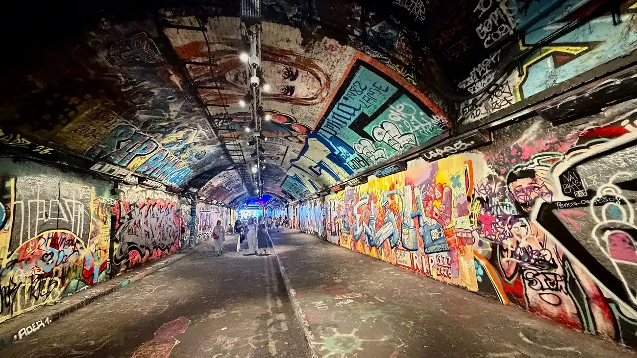 Looking along the graffiti-covered Leake Street tunnel under Waterloo station in London