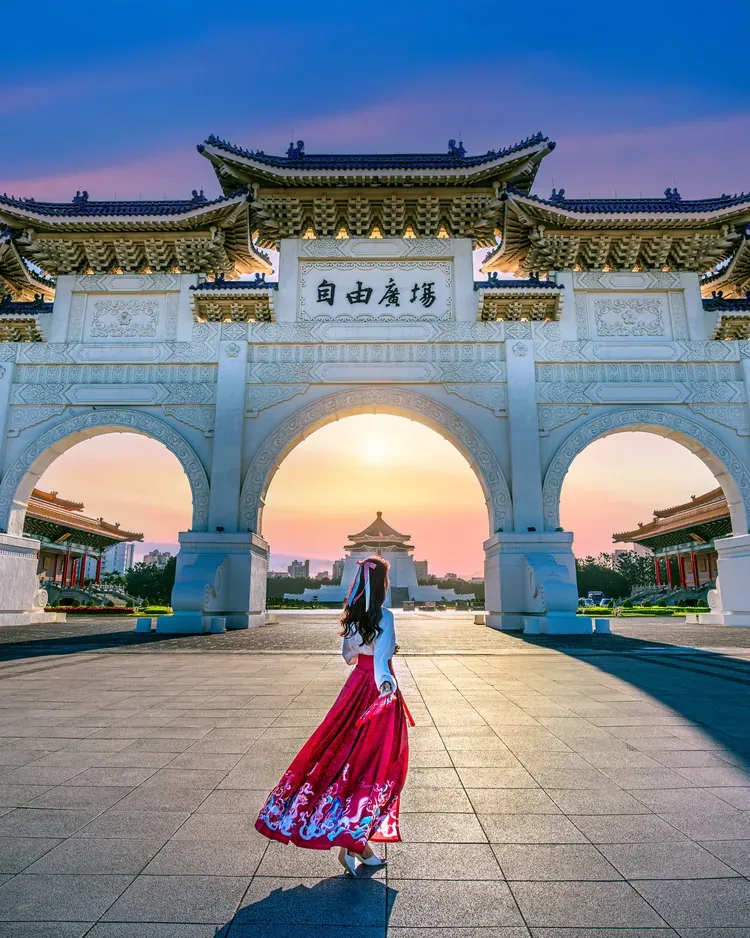 A woman before the Liberty Square archway, Taipei