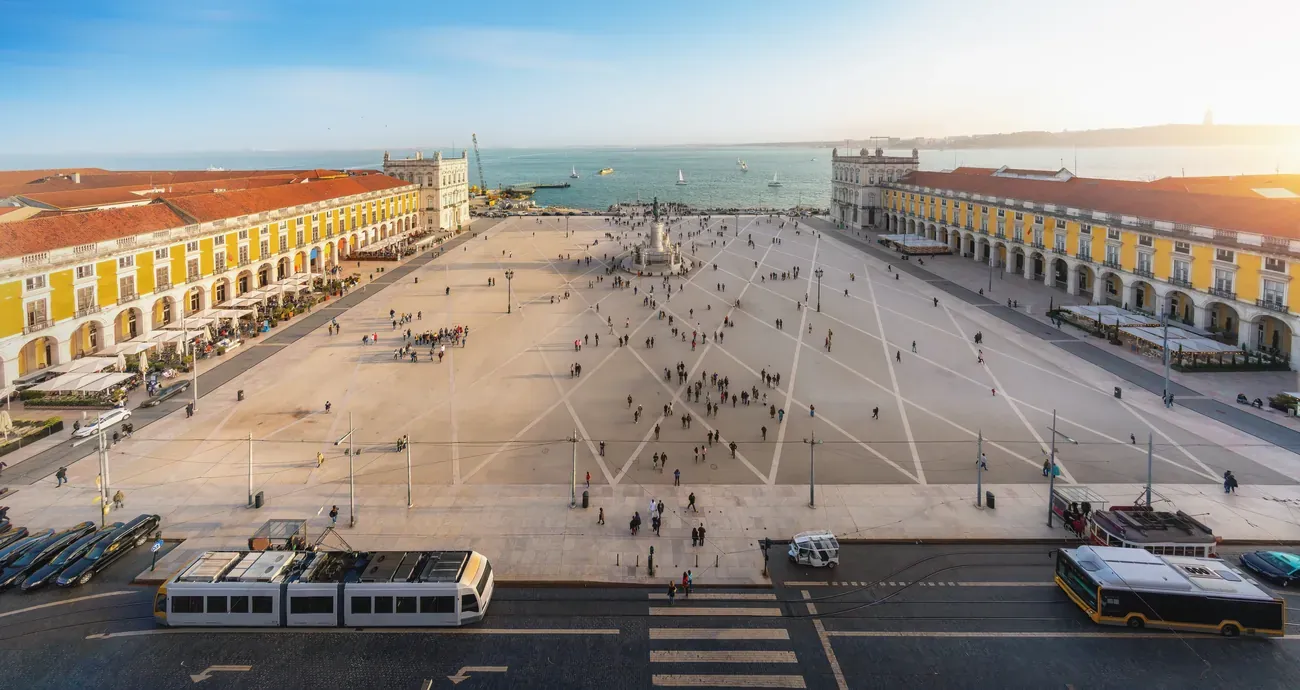 A panoramic aerial view of the Praca do Comercio and the Tagus riverfront in Lisbon