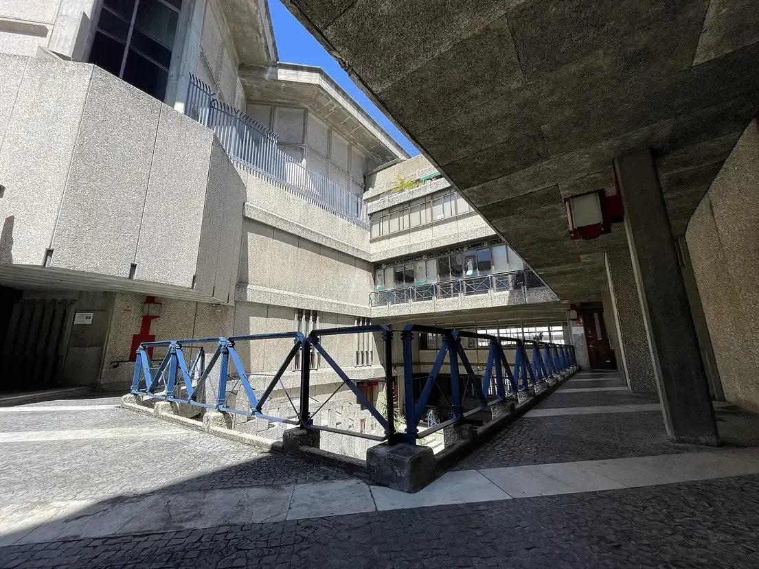 The raw concrete facade and hard geometric lines of the Church of Sagrado Coracao de Jesus in Lisbon