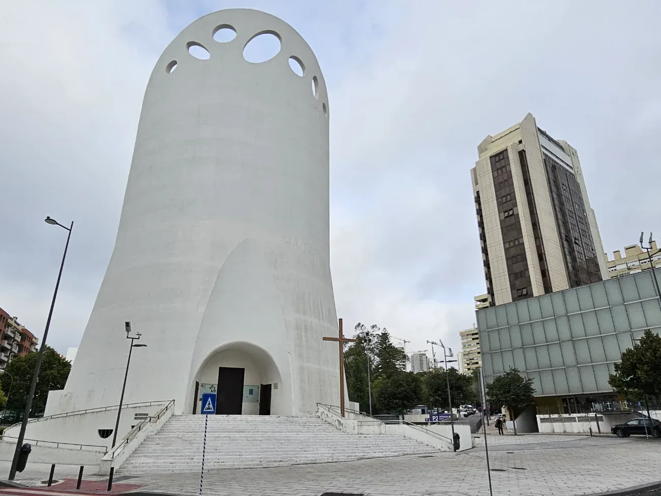 The unusual white concrete form of the Santissima Trindade Church in Miraflores, near Lisbon