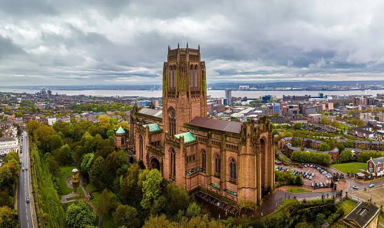 Aerial view of Liverpool Cathedral with the city and the River Mersey behind it