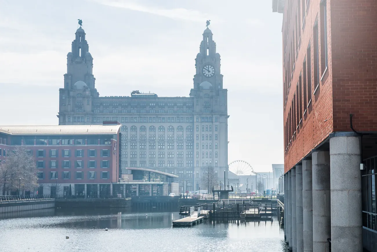 The Liverpool waterfront and Royal Liver Building seen across the dock