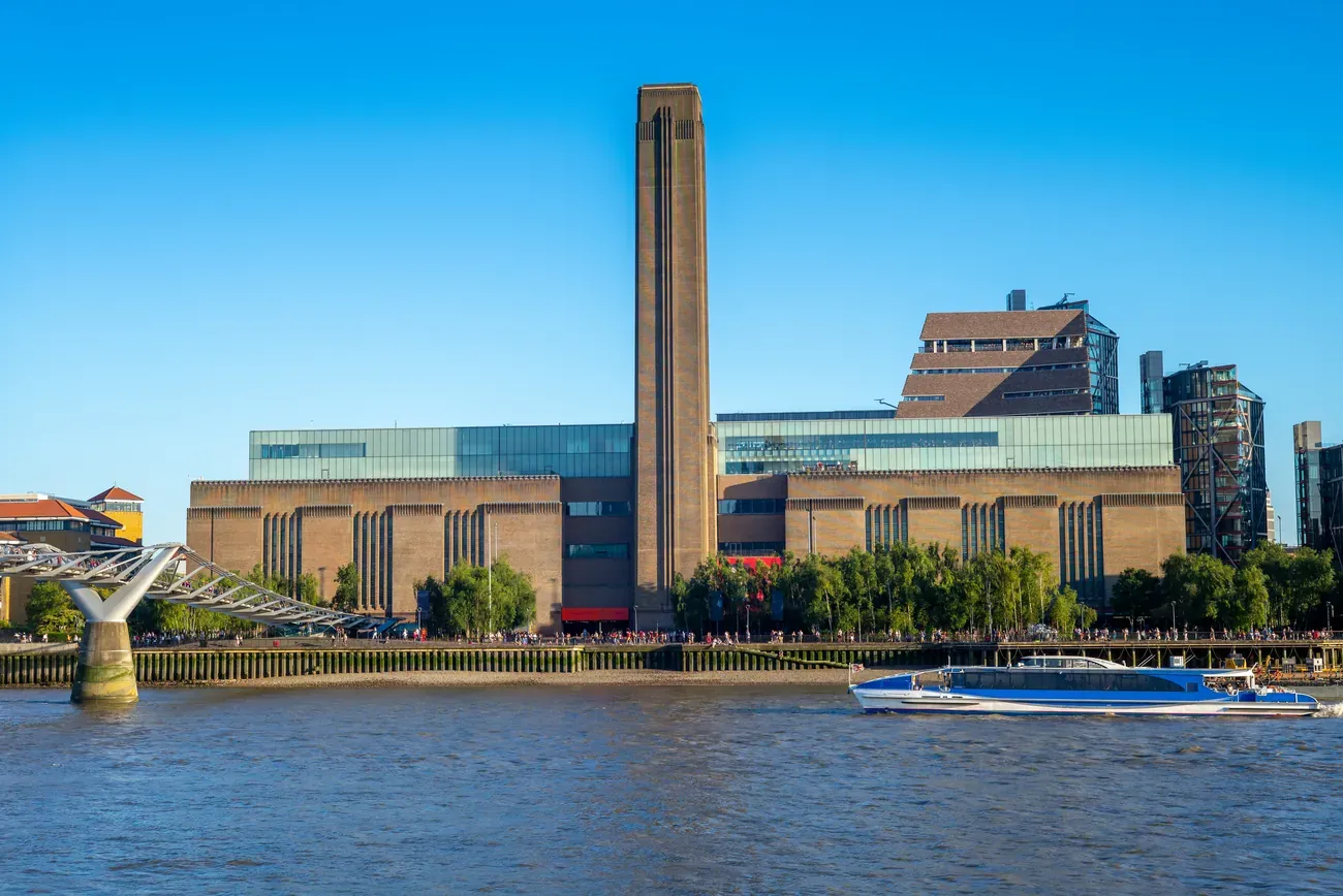 The Tate Modern gallery and the Millennium Bridge on the south bank of the Thames in London