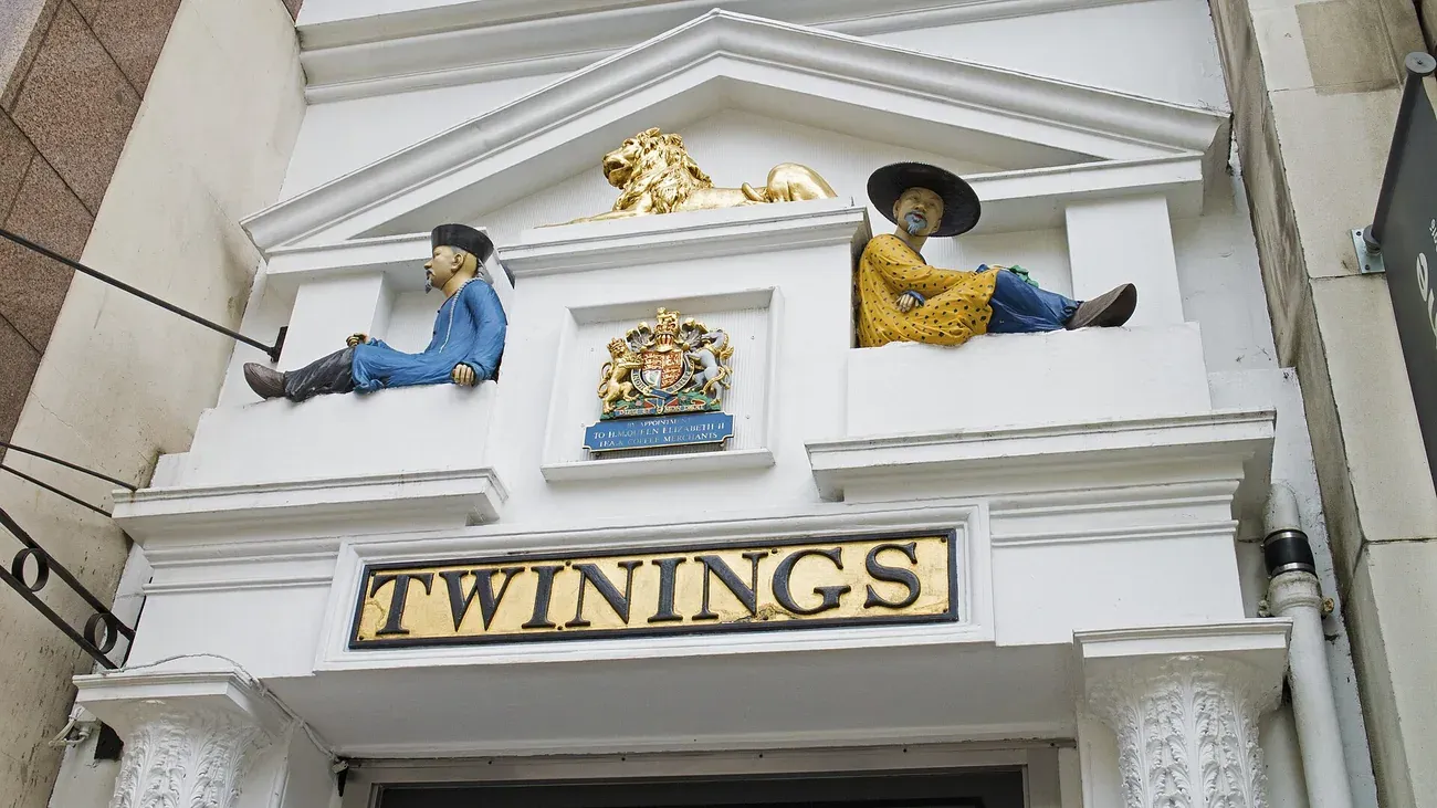 The golden lion and two seated figures above the Twinings doorway on the Strand in London