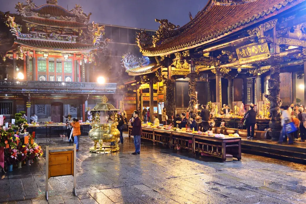 Worshippers inside the Longshan Temple, Taipei