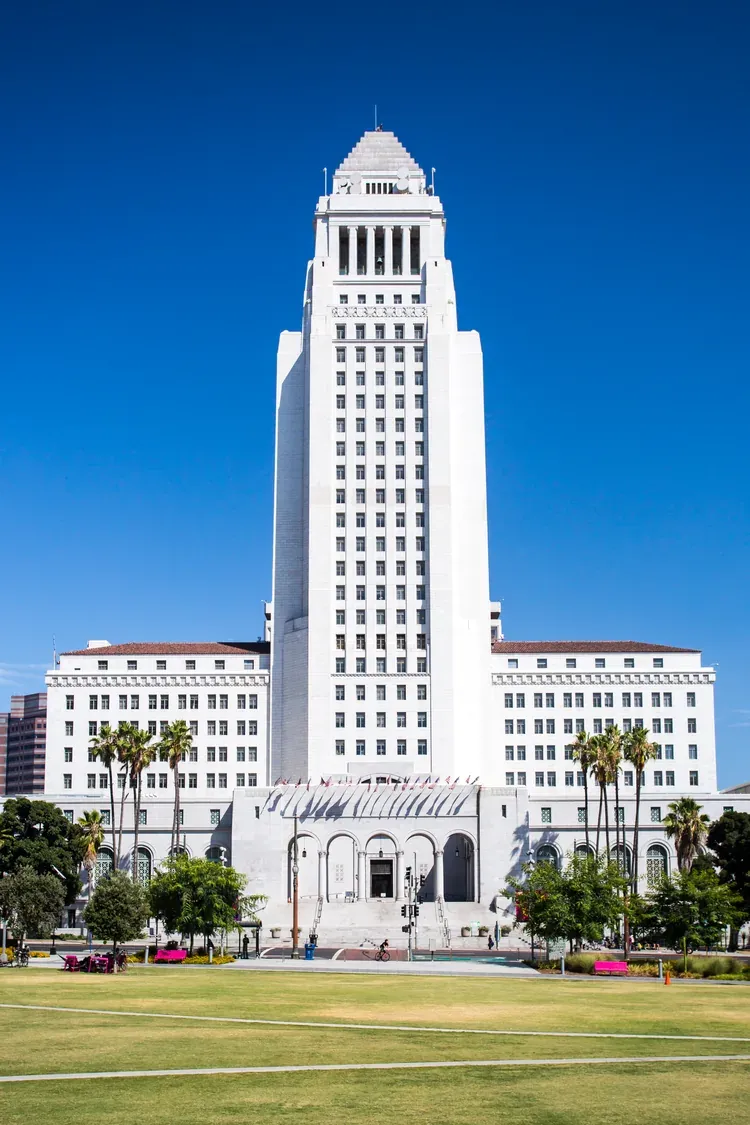 Front view of Los Angeles City Hall under a clear blue sky