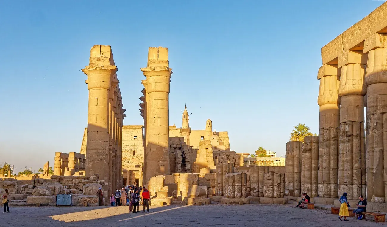 The colonnade of Luxor Temple lit after dark