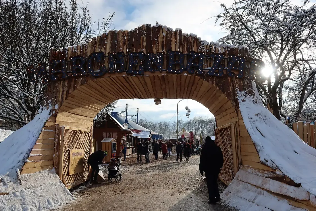 The wooden entrance arch of the Märchenbazar in the Olympiapark, Munich