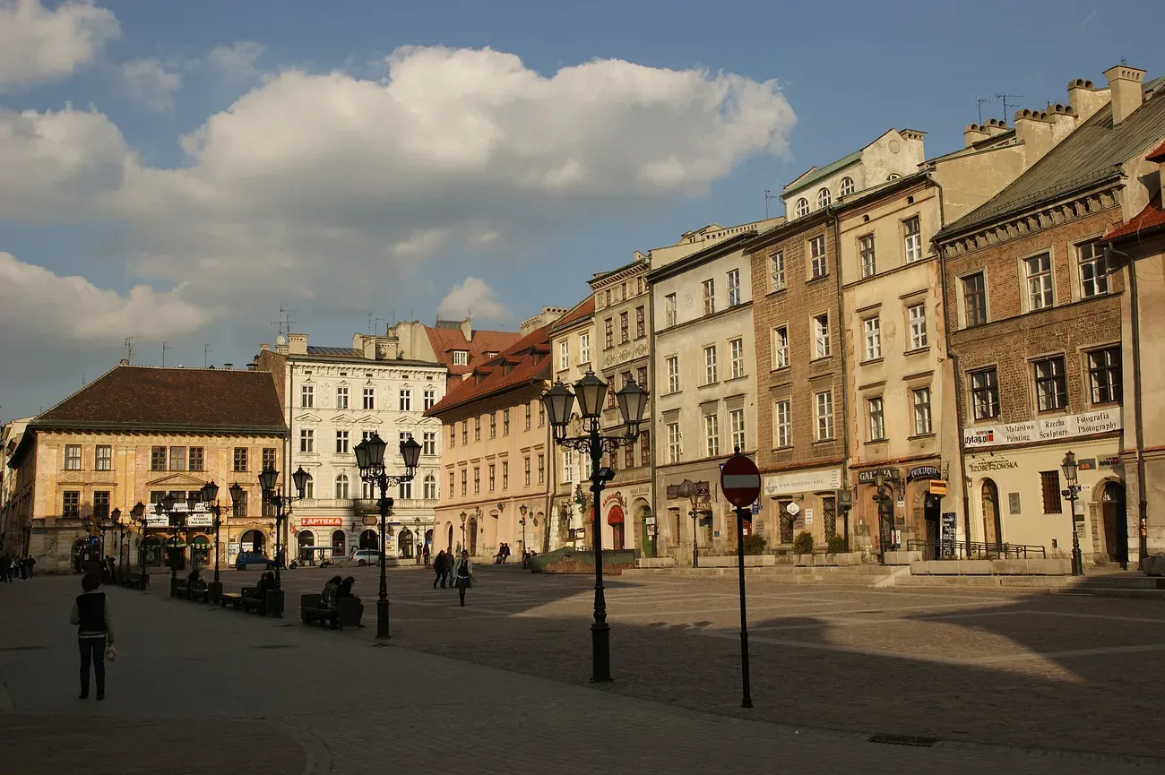 Townhouses and street lamps around the Small Market Square (Mały Rynek) in the Old Town of Krakow in the evening