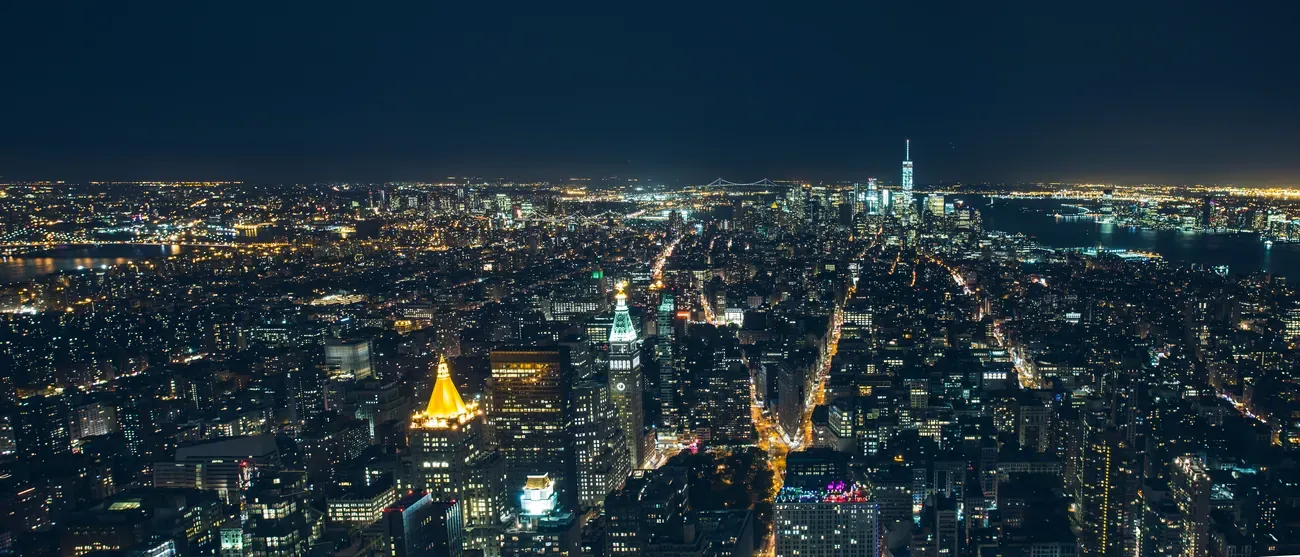 Aerial view of the Manhattan skyline lit up at night, New York City
