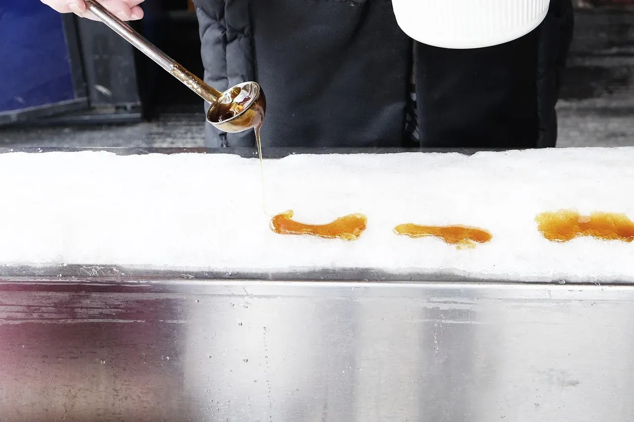 Hot maple syrup poured onto snow to make maple taffy