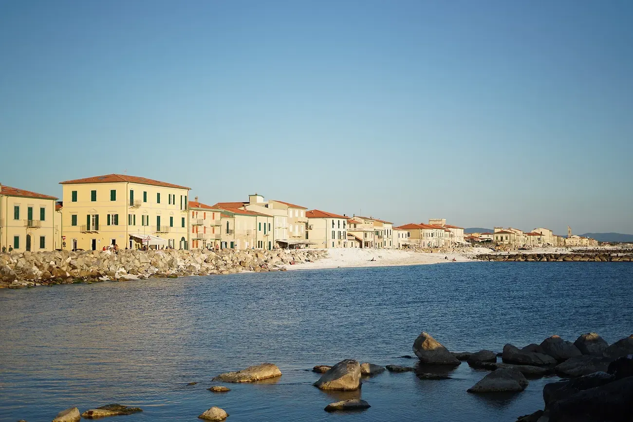 The seafront houses of Marina di Pisa seen from the rocky breakwater