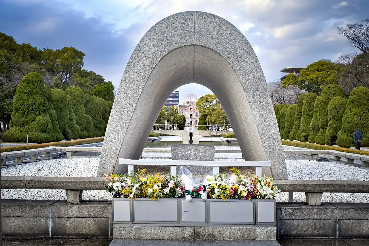 The arch of the memorial cenotaph framing the Genbaku Dome in Hiroshima