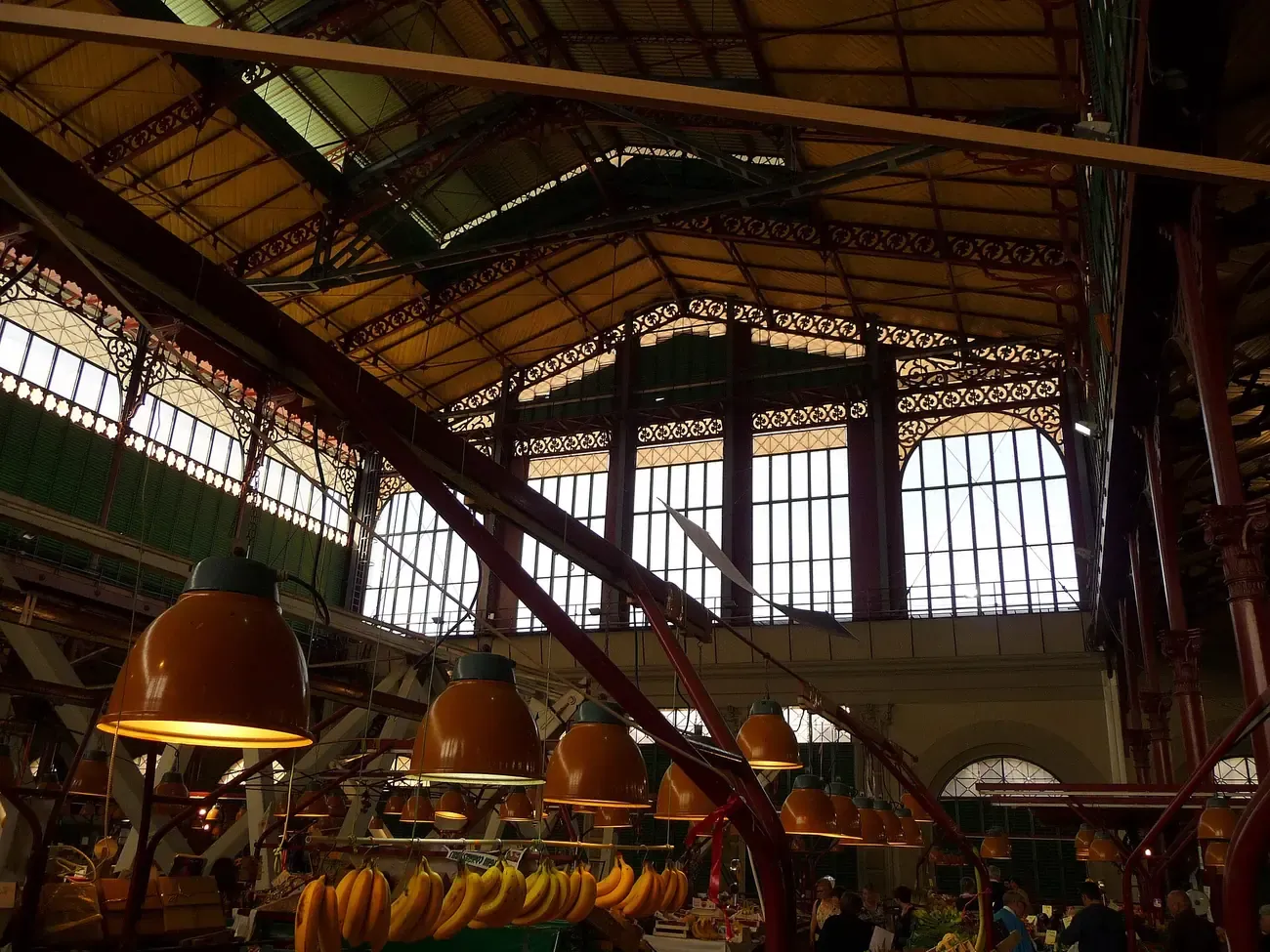 Fruit stalls under the iron and glass roof of the Mercato Centrale food hall in San Lorenzo, Florence