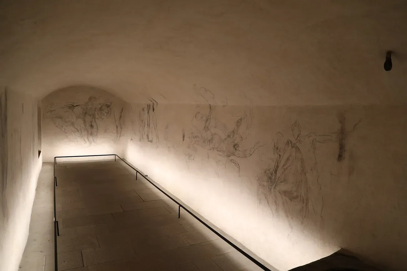 The narrow secret room under the New Sacristy with Michelangelo's charcoal drawings covering its walls, Medici Chapels, Florence