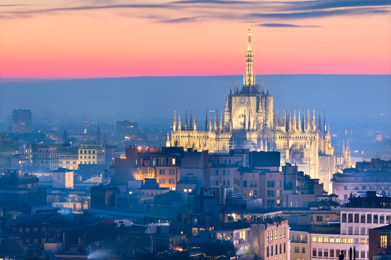 Aerial cityscape of Milan towards the Cathedral at dusk, Italy