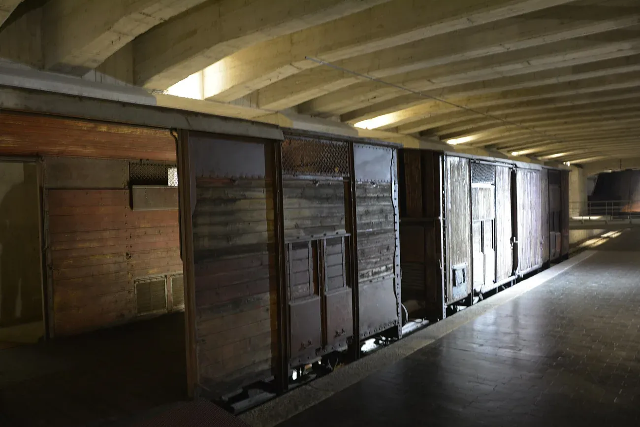 A historic freight wagon on the underground Platform 21 at the Shoah Memorial beneath Milan Central Station