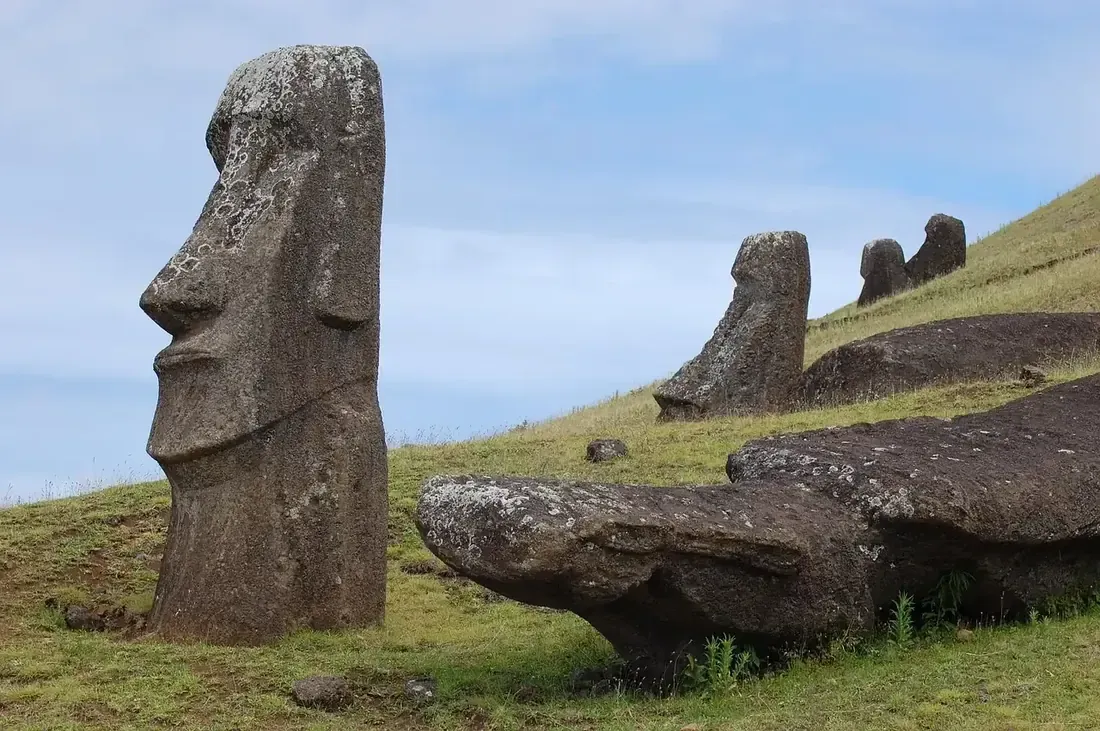Moai heads half buried on the slope of Rano Raraku, Easter Island