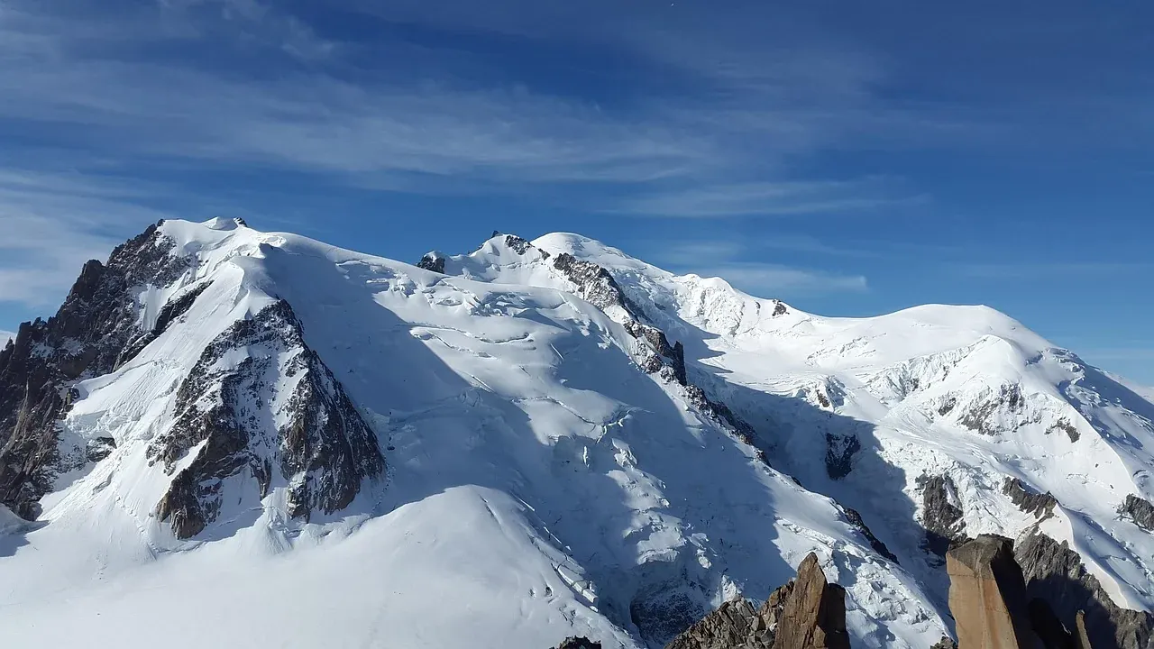 The snow summit of Mont Blanc rising above Chamonix in the French Alps
