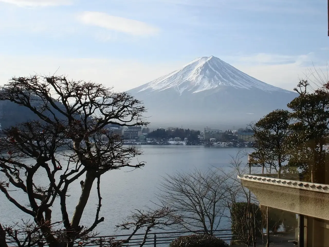Mount Fuji seen across a still lake in winter in Yamanashi prefecture