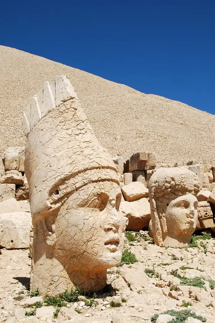 A colossal head below the stone tumulus of Mount Nemrut in Adiyaman province