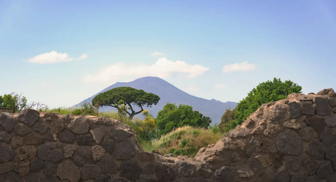 Mount Vesuvius framed by ancient stone ruins at Pompeii