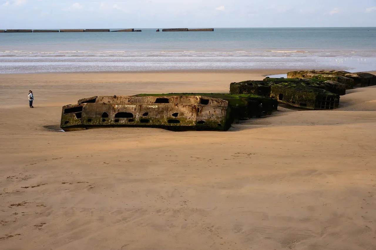 Concrete remains of the Mulberry harbour on the beach at Arromanches-les-Bains, Normandy