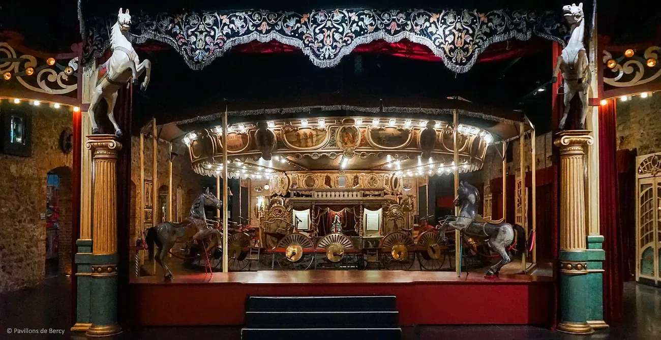 A vintage velocipede carousel at the Musee des Arts Forains in Paris