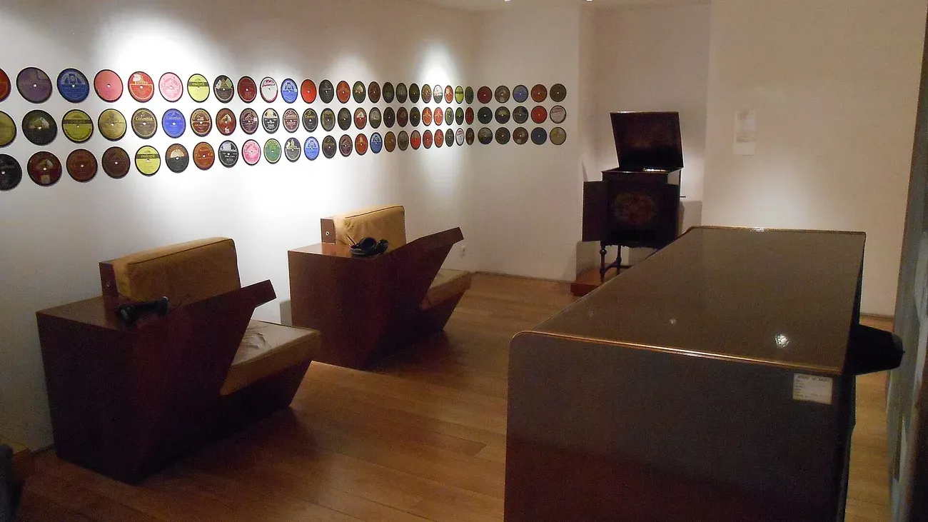 A wall covered with vinyl fado records on display inside the Museu do Fado in Lisbon