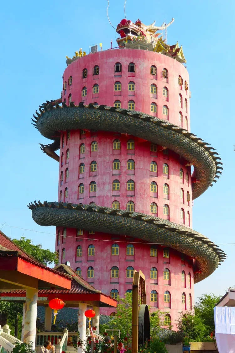 The dragon coiled around the pink tower of Wat Sam Phran, Nakhon Pathom