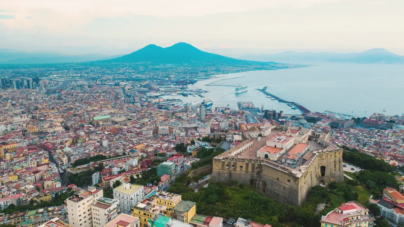 Aerial view of Naples harbor with Castel Sant'Elmo and Mount Vesuvius