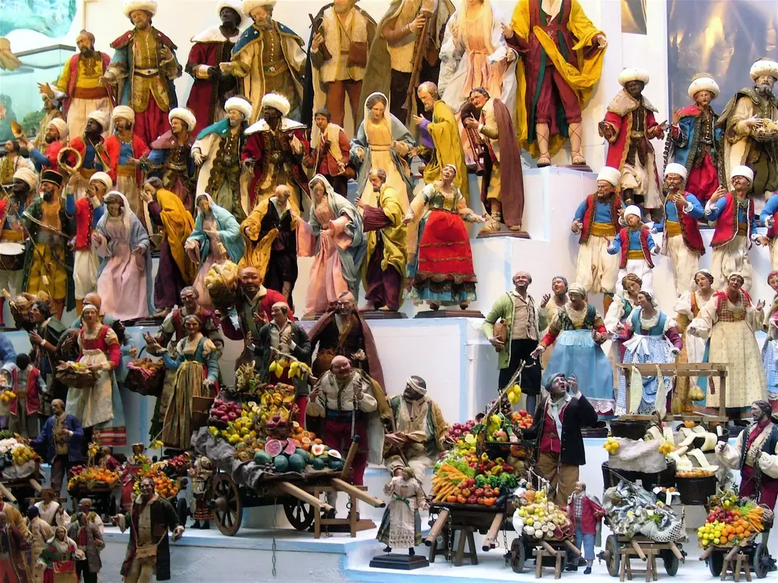 Stall of traditional hand-made nativity figures, shepherds and fruit carts, on Via San Gregorio Armeno in Naples